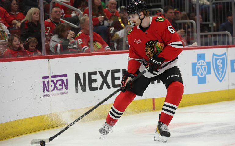 Apr 6, 2025; Chicago, Illinois, USA; Chicago Blackhawks defenseman Sam Rinzel (6) clears the puck during the second period against the Pittsburgh Penguins at United Center. Mandatory Credit: Talia Sprague-Imagn Images