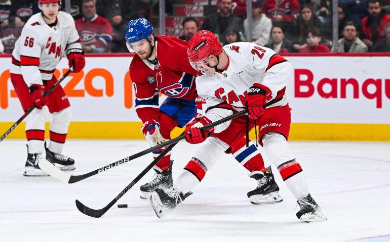Apr 16, 2025; Montreal, Quebec, CAN; Carolina Hurricanes left wing Bradly Nadeau (29) plays the puck against Montreal Canadiens right wing Joel Armia (40) in the third period at Bell Centre. Mandatory Credit: David Kirouac-Imagn Images