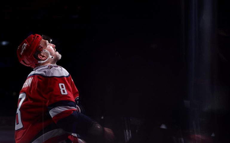 Oct 17, 2025; Washington, District of Columbia, USA; Washington Capitals left wing Alex Ovechkin (8) tosses a puck to a fan in the stands after being named number two star of the game against the Minnesota Wild at Capital One Arena. Mandatory Credit: Geoff Burke-Imagn Images