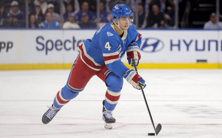Oct 20, 2025; New York, New York, USA; New York Rangers defenseman Braden Schneider (4) skates with the puck against the Minnesota Wild during the second period at Madison Square Garden. Mandatory Credit: Brad Penner-Imagn Images