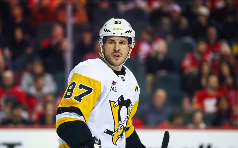 Jan 21, 2026; Calgary, Alberta, CAN; Pittsburgh Penguins center Sidney Crosby (87) against the Calgary Flames during the first period at Scotiabank Saddledome. Mandatory Credit: Sergei Belski-Imagn Images