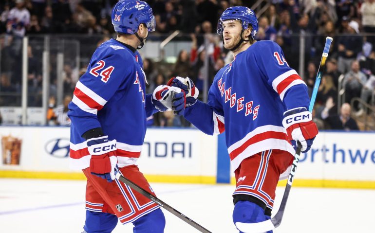 Oct 23, 2025; New York, New York, USA;  New York Rangers right wing Taylor Raddysh (14) celebrates with defenseman Carson Soucy (24) after scoring a goal in the first period against the San Jose Sharks at Madison Square Garden. Mandatory Credit: Wendell Cruz-Imagn Images