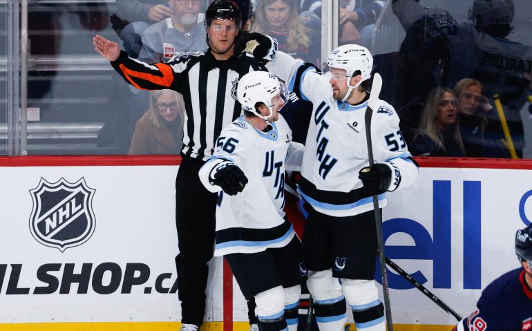 Oct 26, 2025; Winnipeg, Manitoba, CAN; Utah Mammoth forward forward Michael Carcone (53) is congratulated by Utah Mammoth forward forward Kailer Yamamoto (56) on his goal against the Winnipeg Jets during the second period at Canada Life Centre. Mandatory Credit: Terrence Lee-Imagn Images