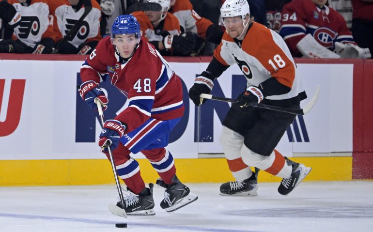 Sep 23, 2025; Montreal, Quebec, CAN; Montreal Canadiens defenseman Lane Hutson (48) plays the puck and Philadelphia Flyers forward Rodrigo Abols (18) defends during the first period at the Bell Centre. Mandatory Credit: Eric Bolte-Imagn Images