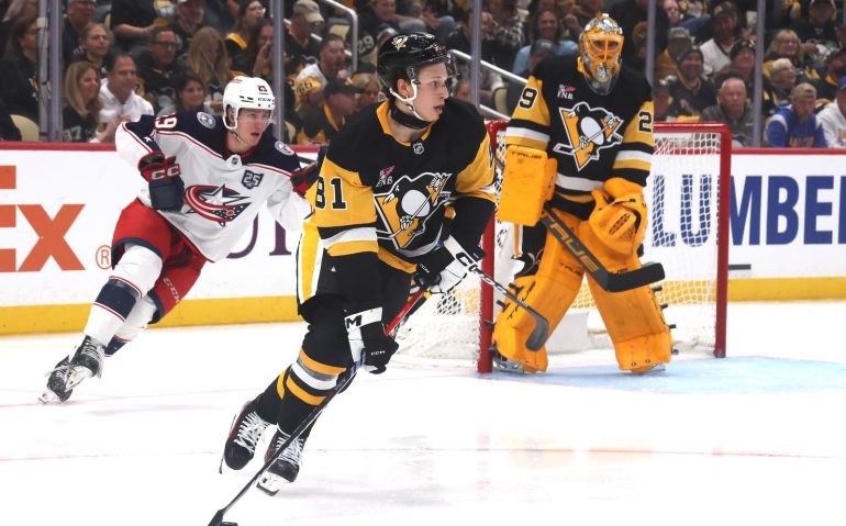 Sep 27, 2025; Pittsburgh, Pennsylvania, USA;  Pittsburgh Penguins center Ben Kindel (81) moves the puck against the Columbus Blue Jackets during the third period at PPG Paints Arena. Mandatory Credit: Charles LeClaire-Imagn Images