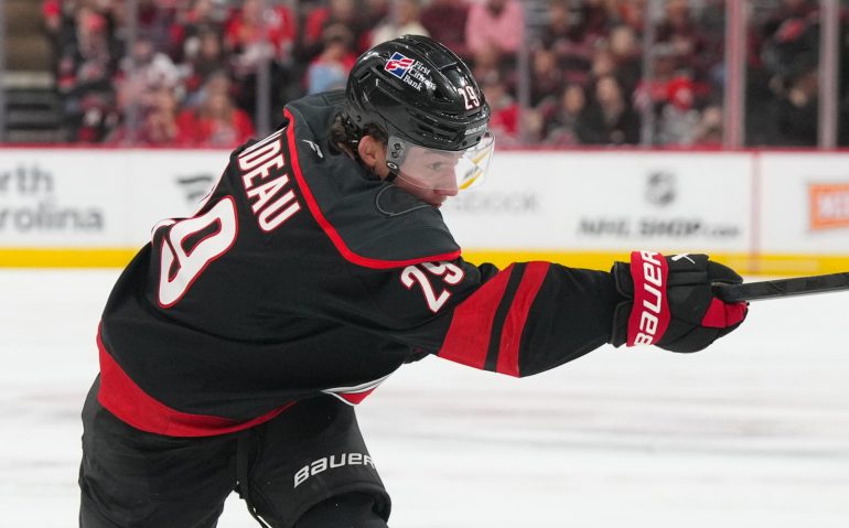 Oct 28, 2025; Raleigh, North Carolina, USA;  Carolina Hurricanes left wing Bradly Nadeau (29) takes a shot against the Vegas Golden Knights during the first period at Lenovo Center. Mandatory Credit: James Guillory-Imagn Images