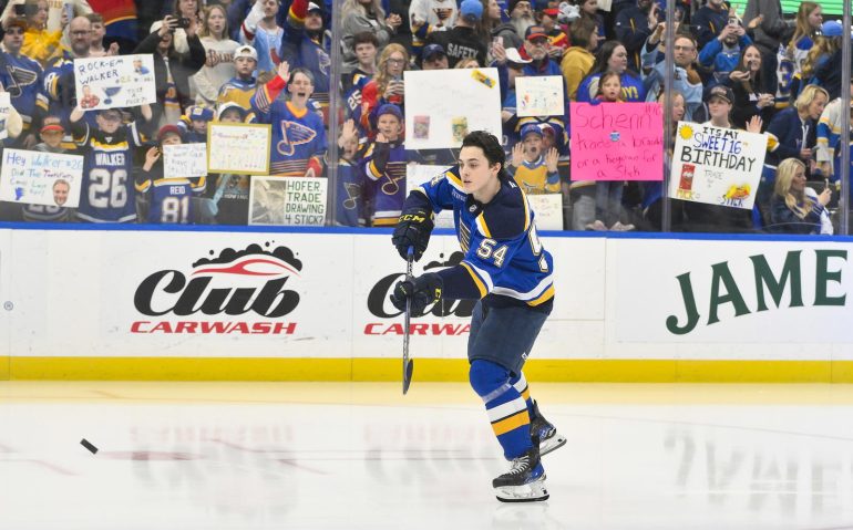 Mar 23, 2025; St. Louis, Missouri, USA;  St. Louis Blues center Dalibor Dvorsky (54) skates during his rookie lap before his first NHL game against the Nashville Predators at Enterprise Center. Mandatory Credit: Jeff Curry-Imagn Images