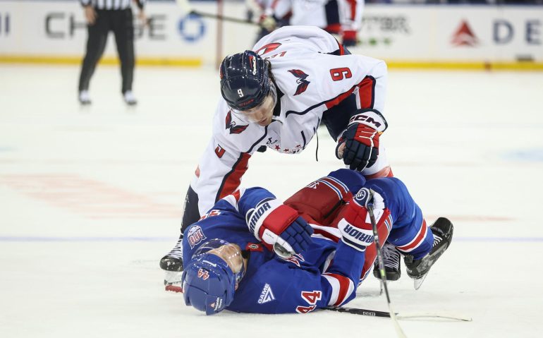 Oct 12, 2025; New York, New York, USA;  Washington Capitals right wing Ryan Leonard (9) collides with New York Rangers defenseman Vladislav Gavrikov (44) in the third period at Madison Square Garden. Mandatory Credit: Wendell Cruz-Imagn Images