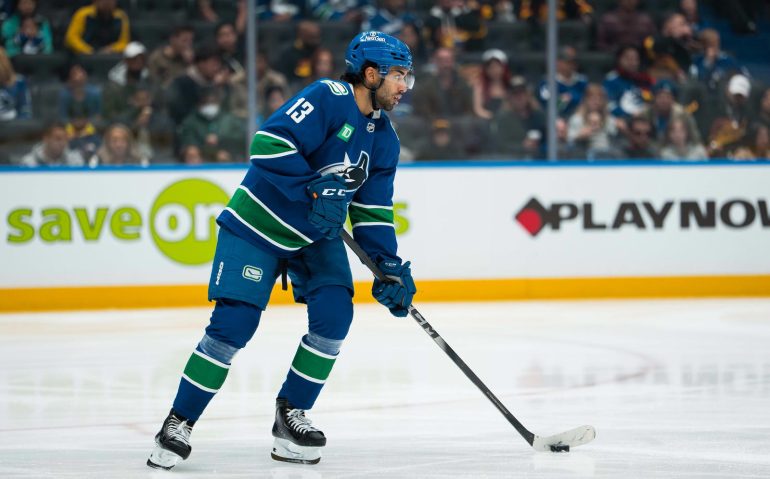 Oct 13, 2025; Vancouver, British Columbia, CAN; Vancouver Canucks forward Arshdeep Bains (13) handles the puck against the St. Louis Blues in the third period at Rogers Arena. Mandatory Credit: Bob Frid-Imagn Images