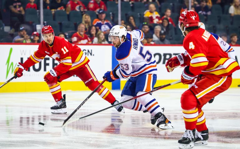 Sep 21, 2025; Calgary, Alberta, CAN; Edmonton Oilers left wing Isaac Howard (53) controls the puck against the Calgary Flames during the first period at Scotiabank Saddledome. Mandatory Credit: Sergei Belski-Imagn Images