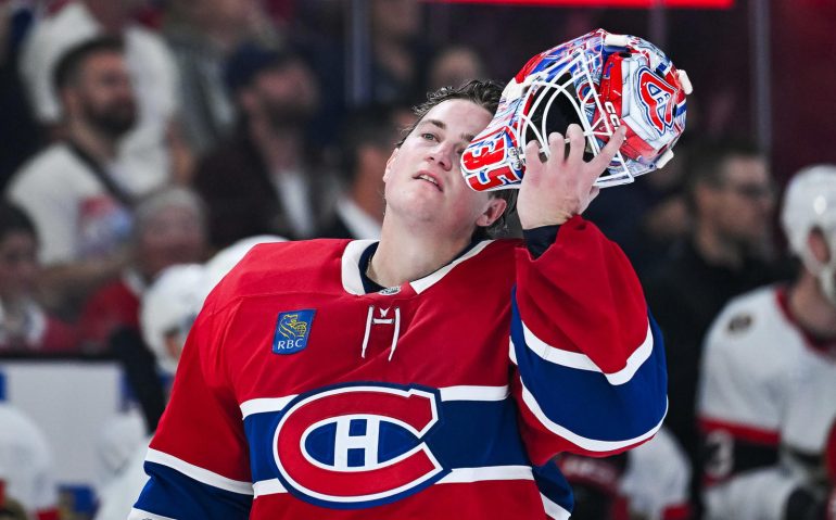 Oct 4, 2025; Montreal, Quebec, CAN; Montreal Canadiens goalie Samuel Montembeault (35) looks on as he pulls on his helmet against the Ottawa Senators during the second period at Bell Centre. Mandatory Credit: David Kirouac-Imagn Images