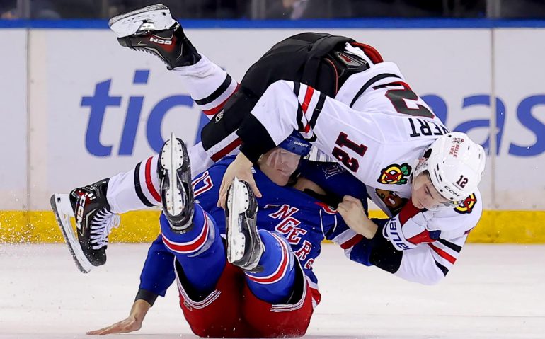 Mar 27, 2026; New York, New York, USA; Chicago Blackhawks center Sacha Boisvert (12) fights with New York Rangers defenseman Will Borgen (17) during the third period at Madison Square Garden. Mandatory Credit: Brad Penner-Imagn Images