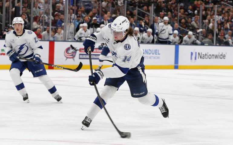 Oct 18, 2025; Columbus, Ohio, USA; Tampa Bay Lightning center Conor Geekie (14) shoots the puck against the Columbus Blue Jackets during the third period at Nationwide Arena. Mandatory Credit: Russell LaBounty-Imagn Images